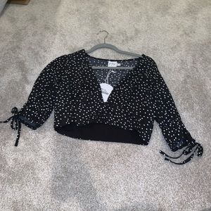 Black top with white polka dots